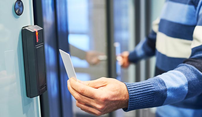 Person swiping keycard for office access