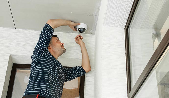 person installing cctv camera