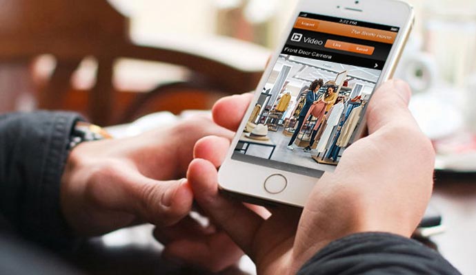 Person viewing live security footage on smartphone