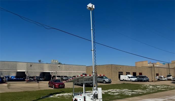 Mobile surveillance trailer in parking lot